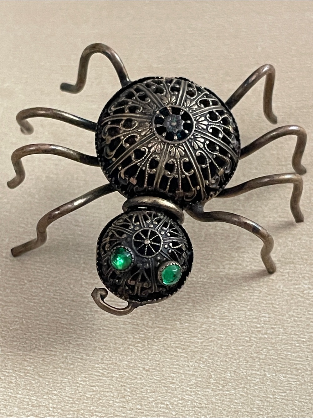 Vintage Filigree Spider Brooch with Green Rhinestone Eyes
